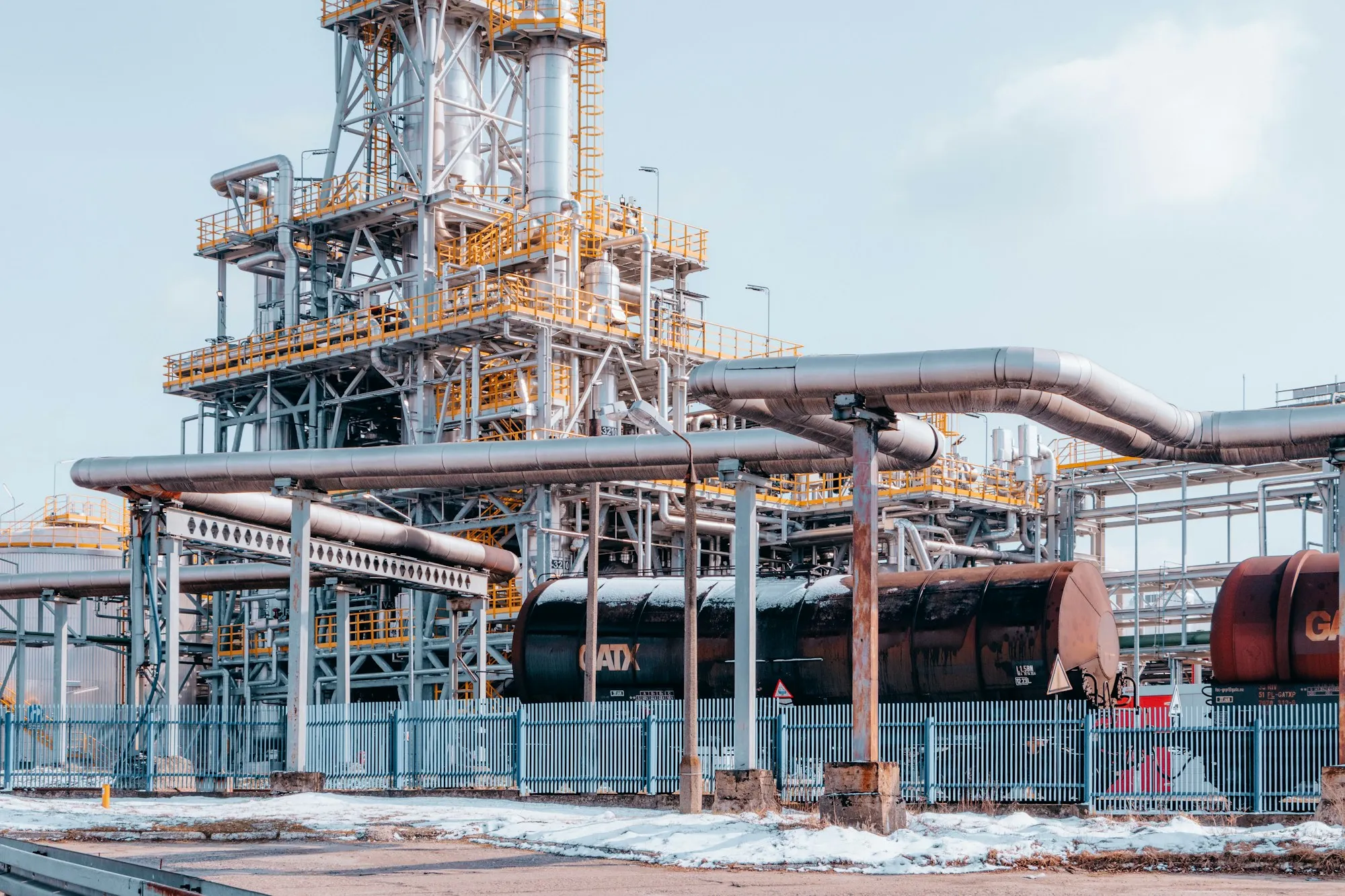 Process tower and pipework at an oil and gas processing facility